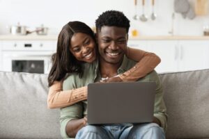 Closeup of african american family using computer at home
